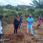 youth planting trees at Buyoga