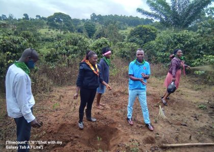 youth planting trees at Buyoga