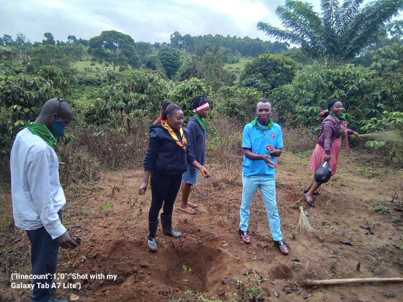 youth planting trees at Buyoga